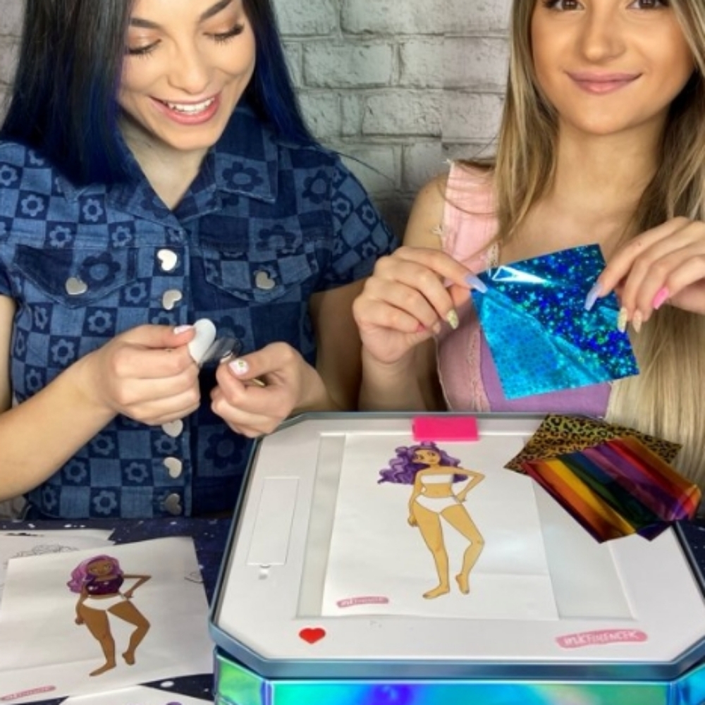 Lighted box paper doll maker set.